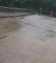 Flash Flooding Forces Debris Under Bridge