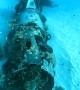 Scuba Divers Explore the Corsair Dive Site