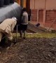 Worker Takes a Tumble While Carrying Equipment