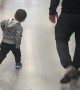 Little Boy Practices Walking Like Dad