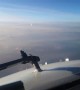 Oncoming Aircraft Passes Beneath Plane