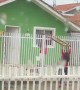 Kids Create Teeter-Totter Using Fence and a Ladder