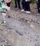 Athlete Dives Into Mud Puddle During Race