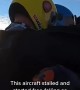 Skydivers\' plane goes into free fall and spins past them after it stalls
