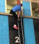 Competitive Firefighter Climbs Up Ladder