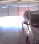 Car Backs into Garage Door Before It's Fully Open