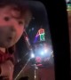 Surprised toddler in awe of Christmas lights display