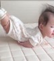 Toddler hilariously lays with her legs in the air