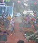 Man Drinking Coffee Dodges Falling Tree in Restaurant