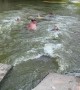 Girls Swims Through Concrete Culvert