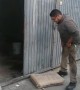Man Attempts to Carry Sack of Cement Up Ladder