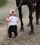 Little Girl Leads Horse