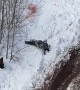 Hill Climber Trying to Stop Tumbling Snowmobile Gets Beat Up