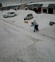 Massive Amount of Snow Slides off Roof Near Family