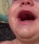 Baby Giggles While Getting His Face Cleaned