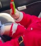 Baby Excitedly Plays with Toy in Car