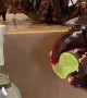 Lobster Helps Make Drink with Lime