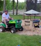 Husband Goofing off on Lawnmower Ends up Dragging Behind it