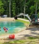 Man Uses Excavator to Create Makeshift Water Park for Kids