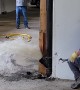 Opening a Sewer Pipe Inside a Garage