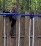 Kid Gets Stuck Trying to Climb Fence