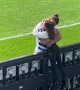 Professional Soccer Player Hugs Daughter During Game