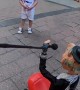 Puppeteer Improvises With a Child at Street Show
