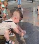Toddler Surprised By Fountain