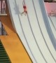 Daredevil jumps from roof of waterpark slide after doing a handstand 