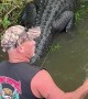 Man Jumps Out of Boat to Help Distressed Gator onto Land