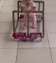 Baby Takes a Stroll in Homemade Walker
