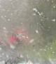 People wait in their car after surprise extreme hail storm