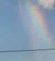 Rainbow Appears to Pour Out of Cloud