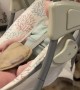 Cat Appears to Swing Baby in Rocker
