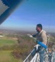 Man Shows How He Paints a Tall Tower for Work