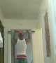 Guy Working out with Door Pull-Up Bar Hits the Ground