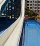Grandmother Climbs into Water Slide and Gets Hit