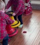 Twin Boys Toss Their Toys in Excitement