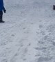Catching Air Sledding Down a Snowy Slope