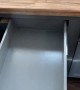 Carpenter Showcases Sliding Drawer Near Fridge