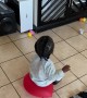 Toddler Using a Balloon as a Chair Pops It