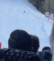 Crowd Cheers for Skier Coming Down Slope