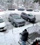 Tree Branch Comes Crashing Down While Man Shovels Snow