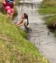 Family Fails to Help Daughter Across Stream