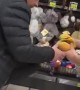Dog Takes Off With Toy in Pet Store
