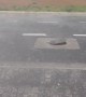 Water Pressure From Storm Creates a Bouncing Manhole Cover