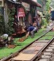 Couple Visit Hanoi's Famous Train Street