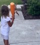 Sister accidentally smacks brother in the face with baseball