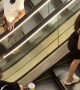 Distracted Person Doesn't Realize Escalator Is Stopped