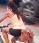 Bicyclist Balances Bottle on Head